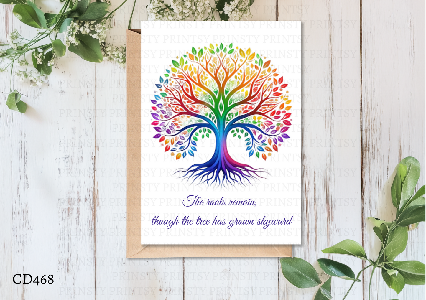 Colorful tree of life design on a card with a white background, surrounded by green leaves.