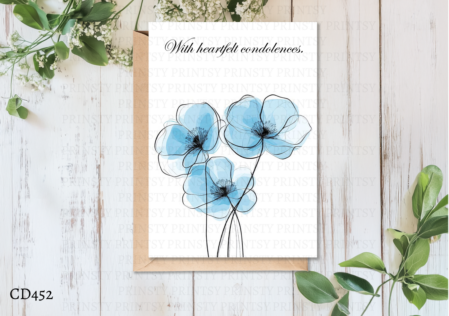 Greeting card with blue flowers on a wooden surface