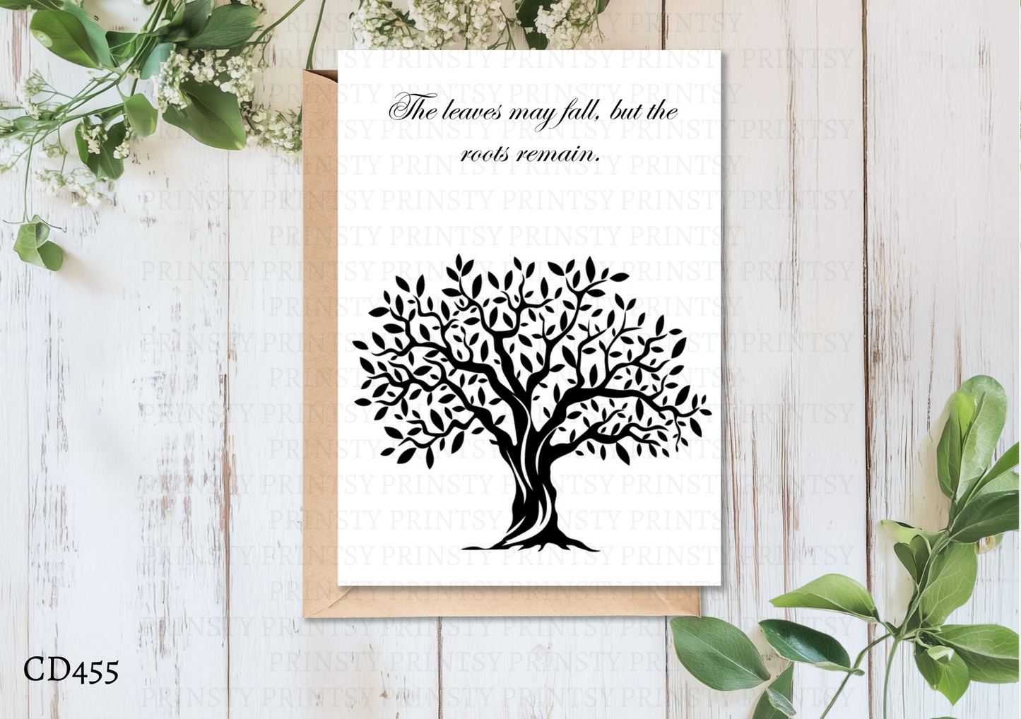 Greeting card with black tree design and text on a white background with wooden texture