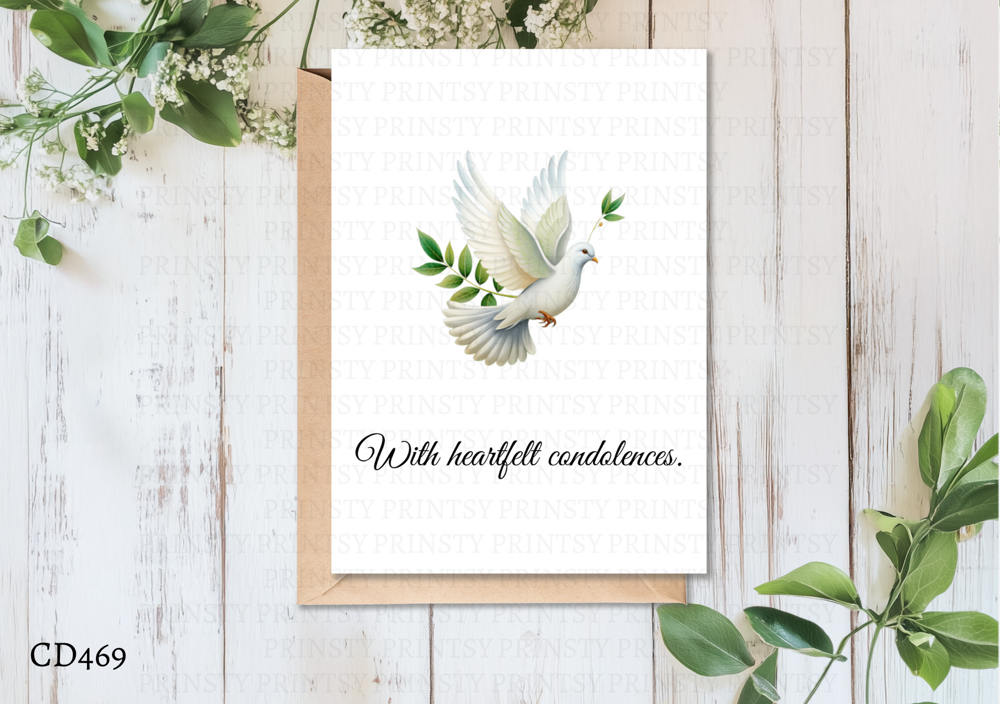 Greeting card with a dove and leaves on a wooden surface