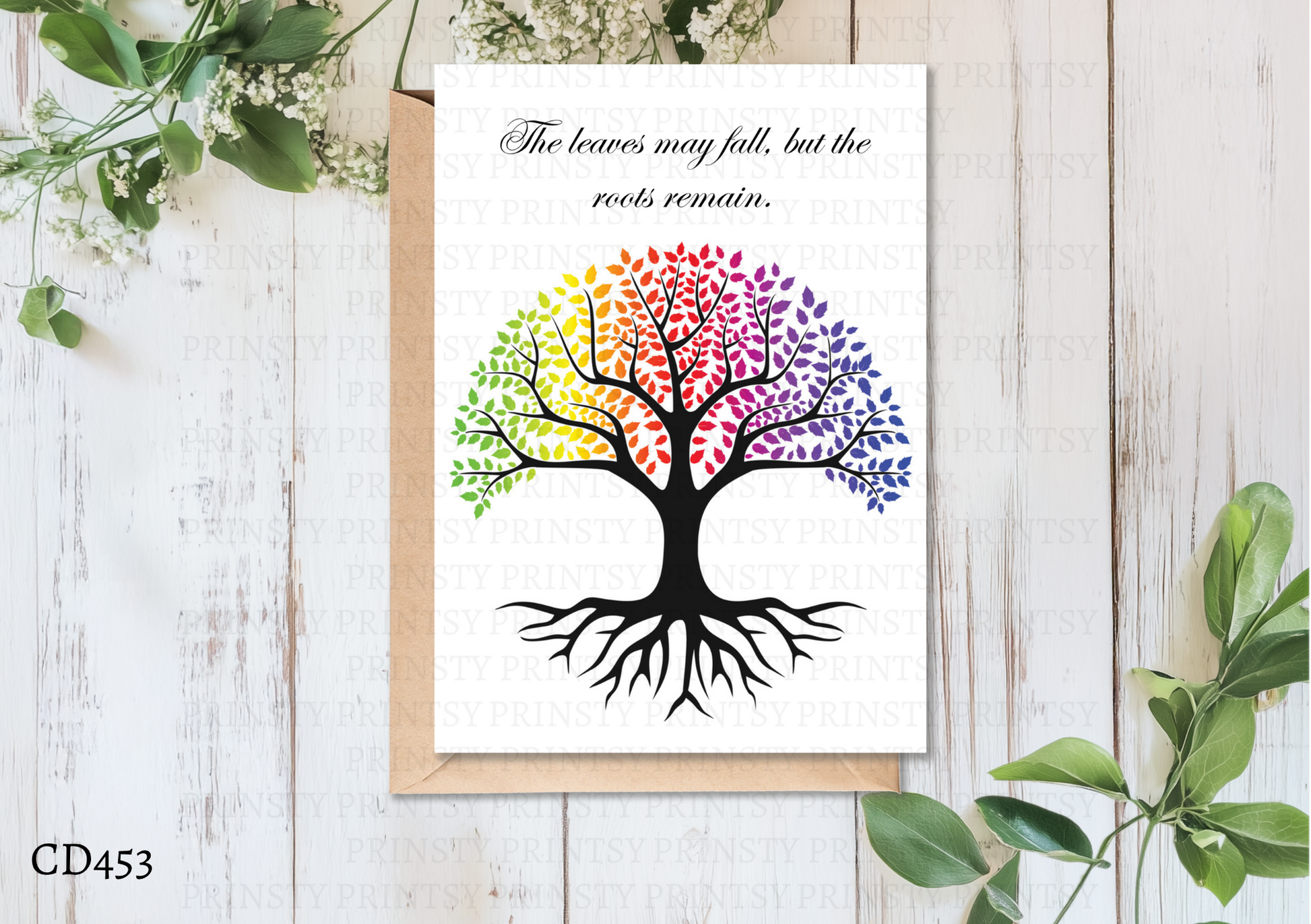 Colorful tree design on a white card with a wooden background