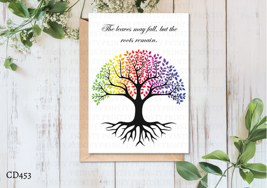 Colorful tree design on a white card with a wooden background