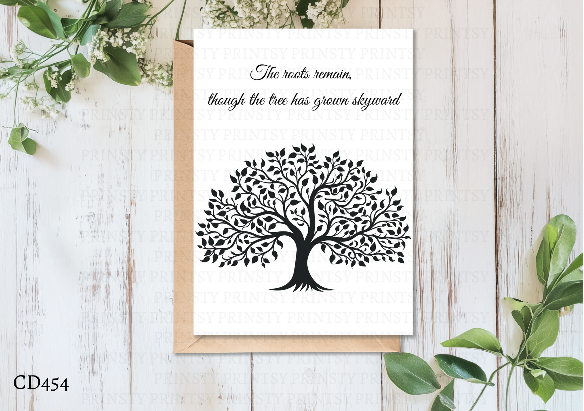 Card with black tree design and text on a white background with greenery.